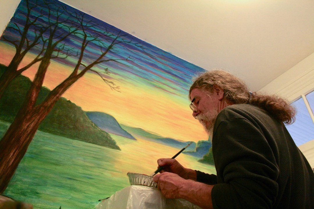 Mark Henson painting Mushroom Cafe mural